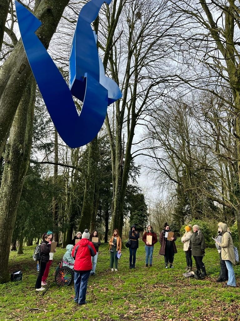 A guided tour in the sculpture park at Roche Court